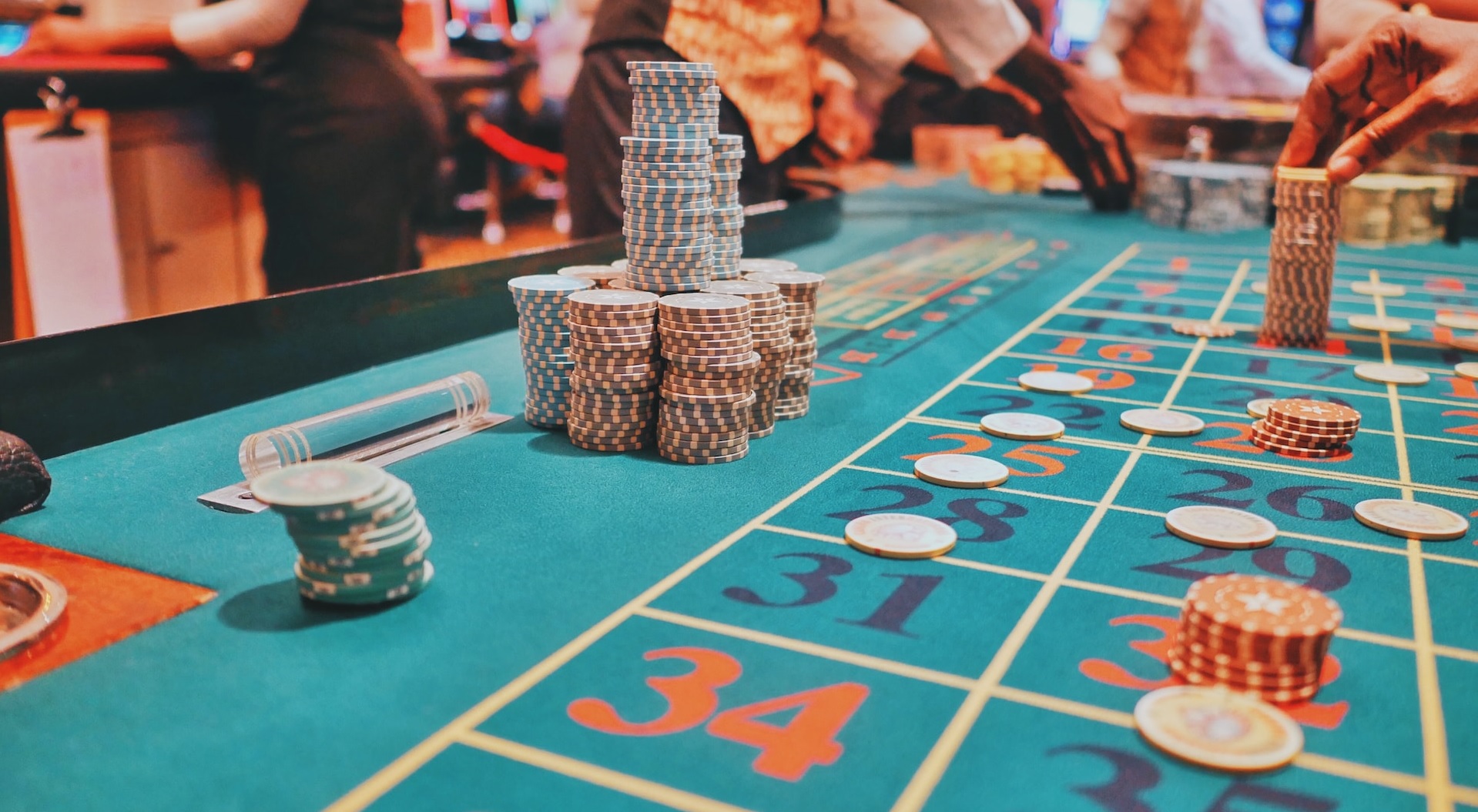Stacks of casino chips on a roulette table during play